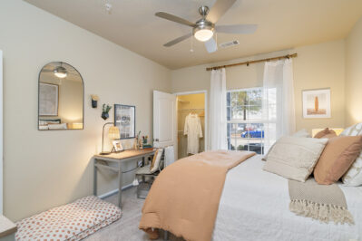 Furnished bedroom with large window