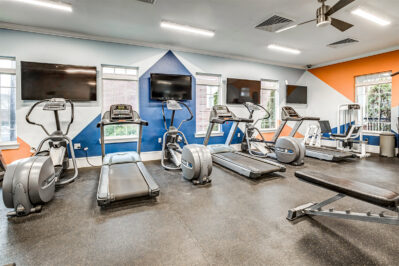 Fitness center with a row of treadmills