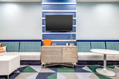 Student housing resident lounge featuring a TV